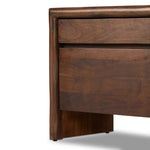 Featuring Nigel Rustic Brown Acacia Nightstand by Four Hands at Amethyst Home. A faux live edge lends natural character to the waterfall frame, its mitered corners enhancing the seamless silhouette. Soft volumes and thick proportions exude a sense of permanence, while chamfered drawer pulls add refined functionality. The warm wood tones celebrate acacia's r. Amethyst Home provides interior design, new home construction design consulting, vintage area rugs, and lighting in the San Diego metro area.