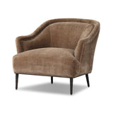 With elements of past eras at play, this updated Deco chair features a rounded back, sloped arms and a dramatic channel. The