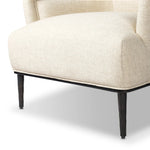 With elements of past eras at play, this updated Deco chair features a rounded back, sloped arms and a dramatic channel. The iron base and tapered legs support the cushiony seat — built with spring suspensions for long-lasting comfort. Amethyst Home provides interior design, new home construction design consulting, vintage area rugs, and lighting in the Scottsdale metro area.