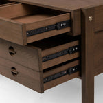 Featuring Oakley Dark Toasted Oak Veneer Desk by Four Hands at Amethyst Home. Made from warm-toasted oak, brass-finished bolt covers add an aesthetic element to a storage-driven desk. Eight drawers plus open shelving offer plenty of space for office staples.Overall Dimensions: 72.00"w x 32.00"d x 30.00"hWeight : 186.29 lbsMaterials: Oak Veneer. Amethyst Home provides interior design, new home construction design consulting, vintage area rugs, and lighting in the Park City metro area.