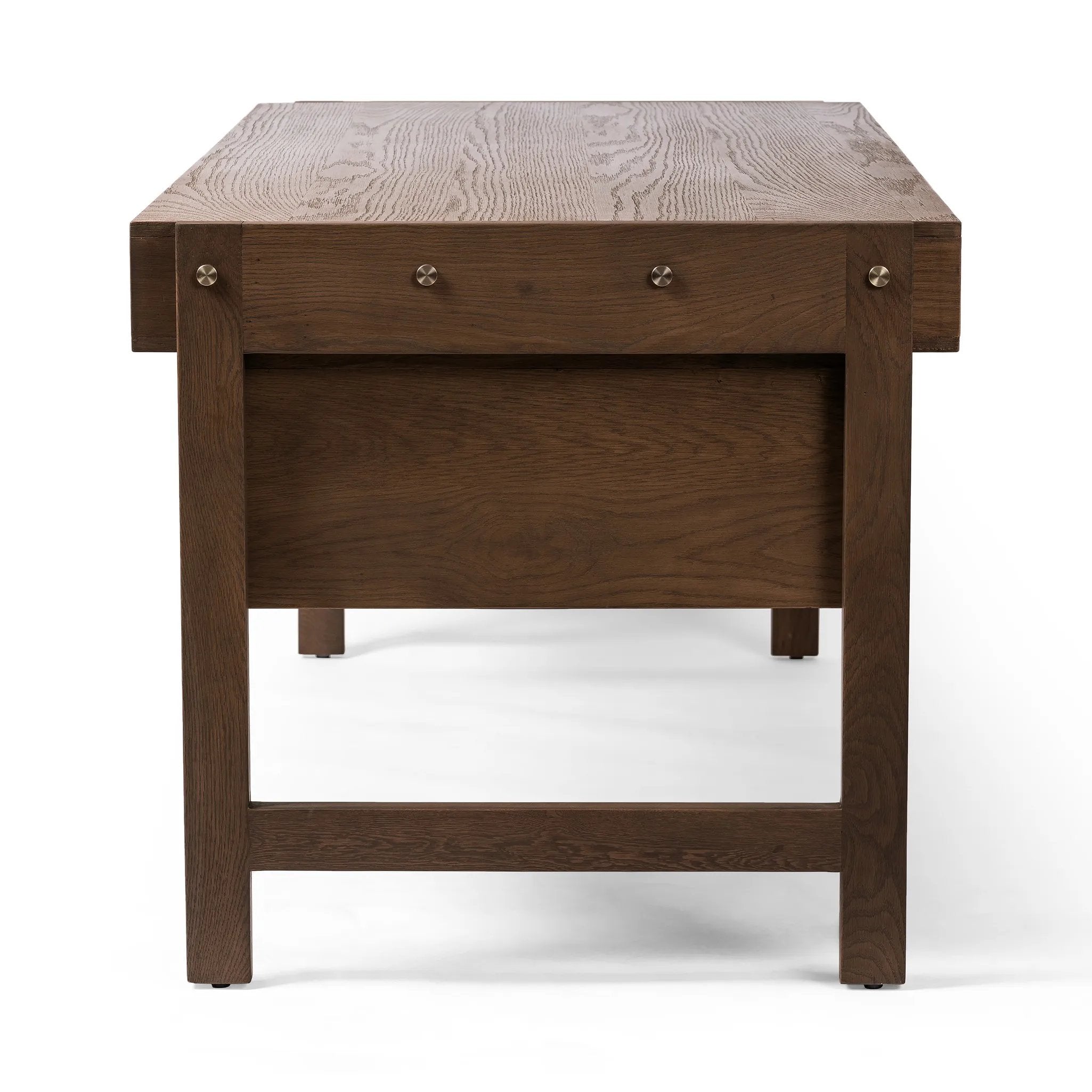Featuring Oakley Dark Toasted Oak Veneer Desk by Four Hands at Amethyst Home. Made from warm-toasted oak, brass-finished bolt covers add an aesthetic element to a storage-driven desk. Eight drawers plus open shelving offer plenty of space for office staples.Overall Dimensions: 72.00"w x 32.00"d x 30.00"hWeight : 186.29 lbsMaterials: Oak Veneer. Amethyst Home provides interior design, new home construction design consulting, vintage area rugs, and lighting in the Winter Garden metro area.