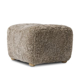 Featuring Oslo Taupe Shearling Ottoman by Four Hands at Amethyst Home. A subtle sweetheart shape paired with beige shearling plays into this ottoman's found object appeal. S-spring suspension offers a comfy place to sit and the shearling upholstery brings depth and vintage vibes throughout. Perfect styled alone or as part of a set for added drama. A design. Amethyst Home provides interior design, new home construction design consulting, vintage area rugs, and lighting in the Des Moines metro area.