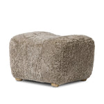 Featuring Oslo Taupe Shearling Ottoman by Four Hands at Amethyst Home. A subtle sweetheart shape paired with beige shearling plays into this ottoman's found object appeal. S-spring suspension offers a comfy place to sit and the shearling upholstery brings depth and vintage vibes throughout. Perfect styled alone or as part of a set for added drama. A des. Amethyst Home provides interior design, new home construction design consulting, vintage area rugs, and lighting in the Newport Beach metro area.