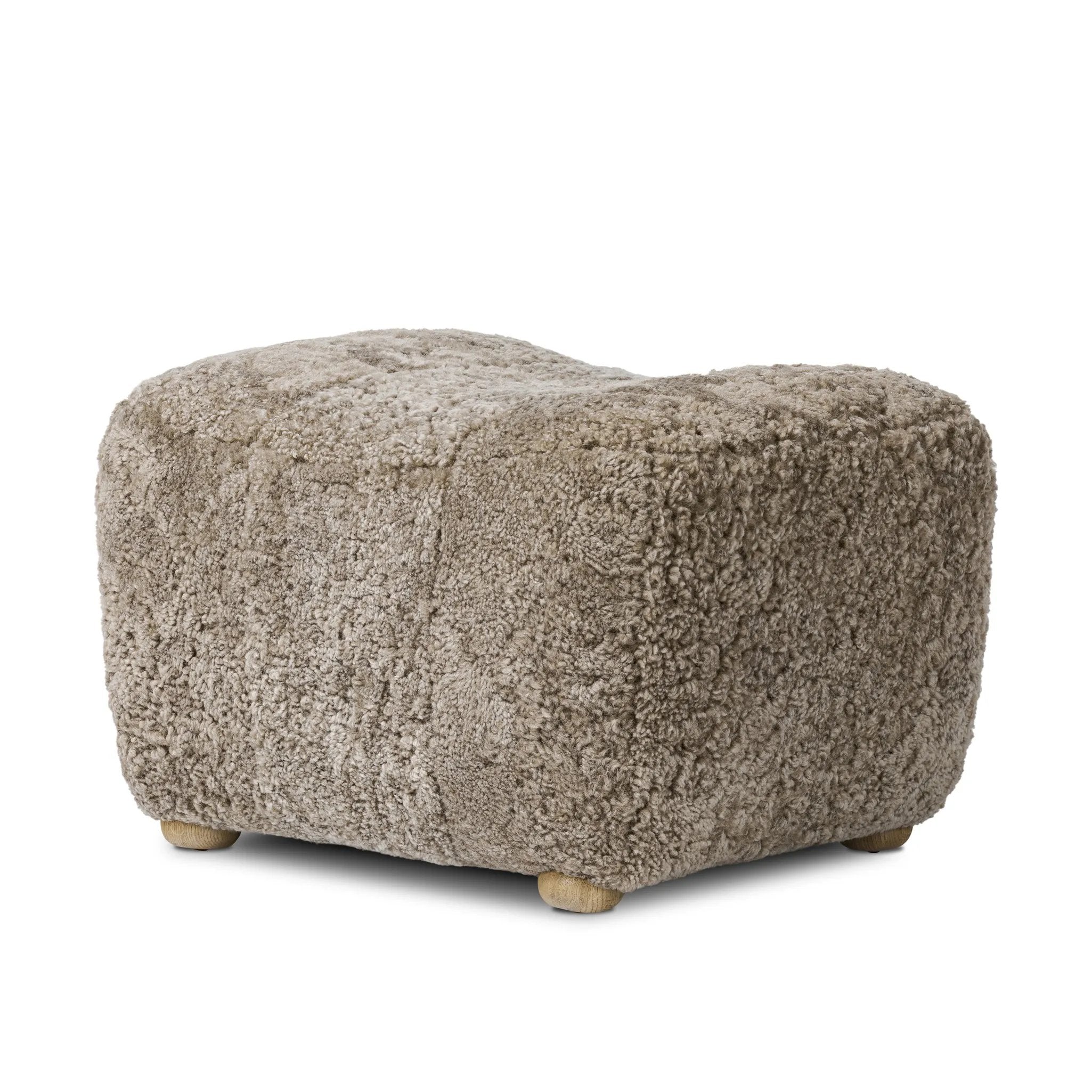 Featuring Oslo Taupe Shearling Ottoman by Four Hands at Amethyst Home. A subtle sweetheart shape paired with beige shearling plays into this ottoman's found object appeal. S-spring suspension offers a comfy place to sit and the shearling upholstery brings depth and vintage vibes throughout. Perfect styled alone or as part of a set for added drama. A des. Amethyst Home provides interior design, new home construction design consulting, vintage area rugs, and lighting in the Newport Beach metro area.