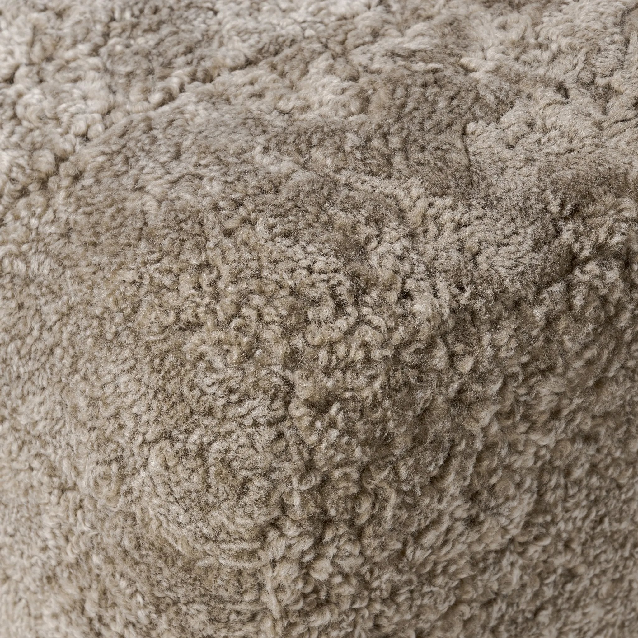 Featuring Oslo Taupe Shearling Ottoman by Four Hands at Amethyst Home. A subtle sweetheart shape paired with beige shearling plays into this ottoman's found object appeal. S-spring suspension offers a comfy place to sit and the shearling upholstery brings depth and vintage vibes throughout. Perfect styled alone or as part of a set for added drama. A design coll. Amethyst Home provides interior design, new home construction design consulting, vintage area rugs, and lighting in the Omaha metro area.