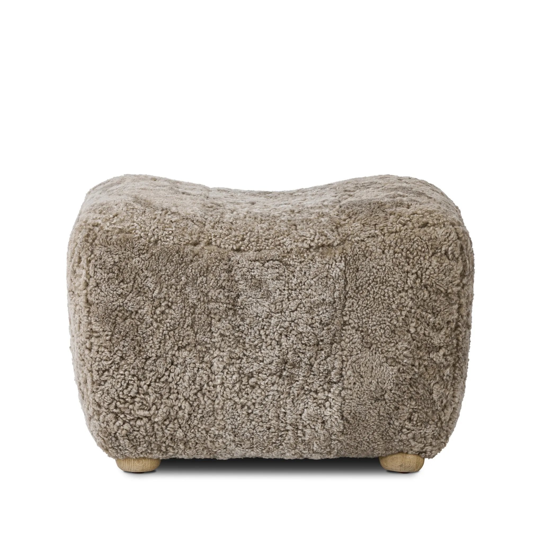 Featuring Oslo Taupe Shearling Ottoman by Four Hands at Amethyst Home. A subtle sweetheart shape paired with beige shearling plays into this ottoman's found object appeal. S-spring suspension offers a comfy place to sit and the shearling upholstery brings depth and vintage vibes throughout. Perfect styled alone or as part of a set for added drama. A design. Amethyst Home provides interior design, new home construction design consulting, vintage area rugs, and lighting in the Scottsdale metro area.