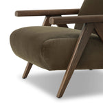 Contemporary outfitting of a vintage chair design offers easy comfort. Upholstered in velvety olive green, the wooden frame is finished in a vintage ash hue. Ideally placed as an accent chair or in pairs Amethyst Home provides interior design, new home construction design consulting, vintage area rugs, and lighting in the Washington metro area.