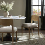 Featuring Piran Essence Natural Dining Chair by Four Hands at Amethyst Home. A celebration of simplicity. Natural nettlewood frames a comfortable linen-blend seat, while a subtle arc at the backrest's base softens clean, tapered lines. Performance fabrics are specially created to withstand spills, stains, high traffic and wear, ensuring long-term comfort and . Amethyst Home provides interior design, new home construction design consulting, vintage area rugs, and lighting in the Seattle metro area.