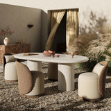 A simple double pedestal silhouette designed to let the material shine. This outdoor dining table features textured sand concrete meant to resemble the variance of natural stone, with a marbled look that's unique to each piece. Cover or store indoors during inclement weather and when not in use Amethyst Home provides interior design, new home construction design consulting, vintage area rugs, and lighting in the Houston metro area.