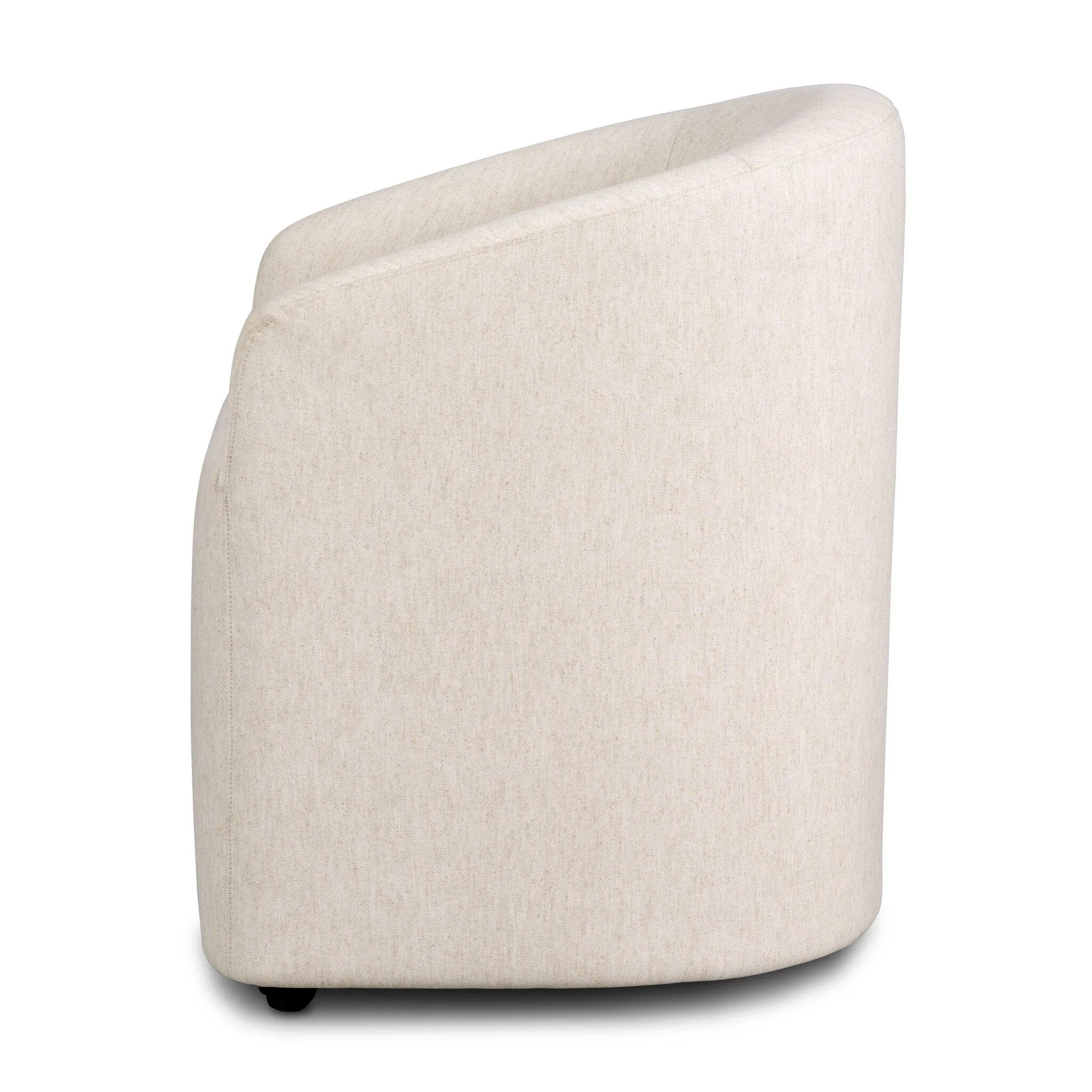 A fully upholstered barrel-style back dining chair creates a comfortable, cocoon-like sit. Slight scale perfect for smaller dining spaces Amethyst Home provides interior design, new home construction design consulting, vintage area rugs, and lighting in the Austin metro area.