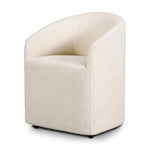 A fully upholstered barrel-style back dining chair creates a comfortable, cocoon-like sit. Slight scale perfect for smaller dining spaces Amethyst Home provides interior design, new home construction design consulting, vintage area rugs, and lighting in the Calabasas metro area.