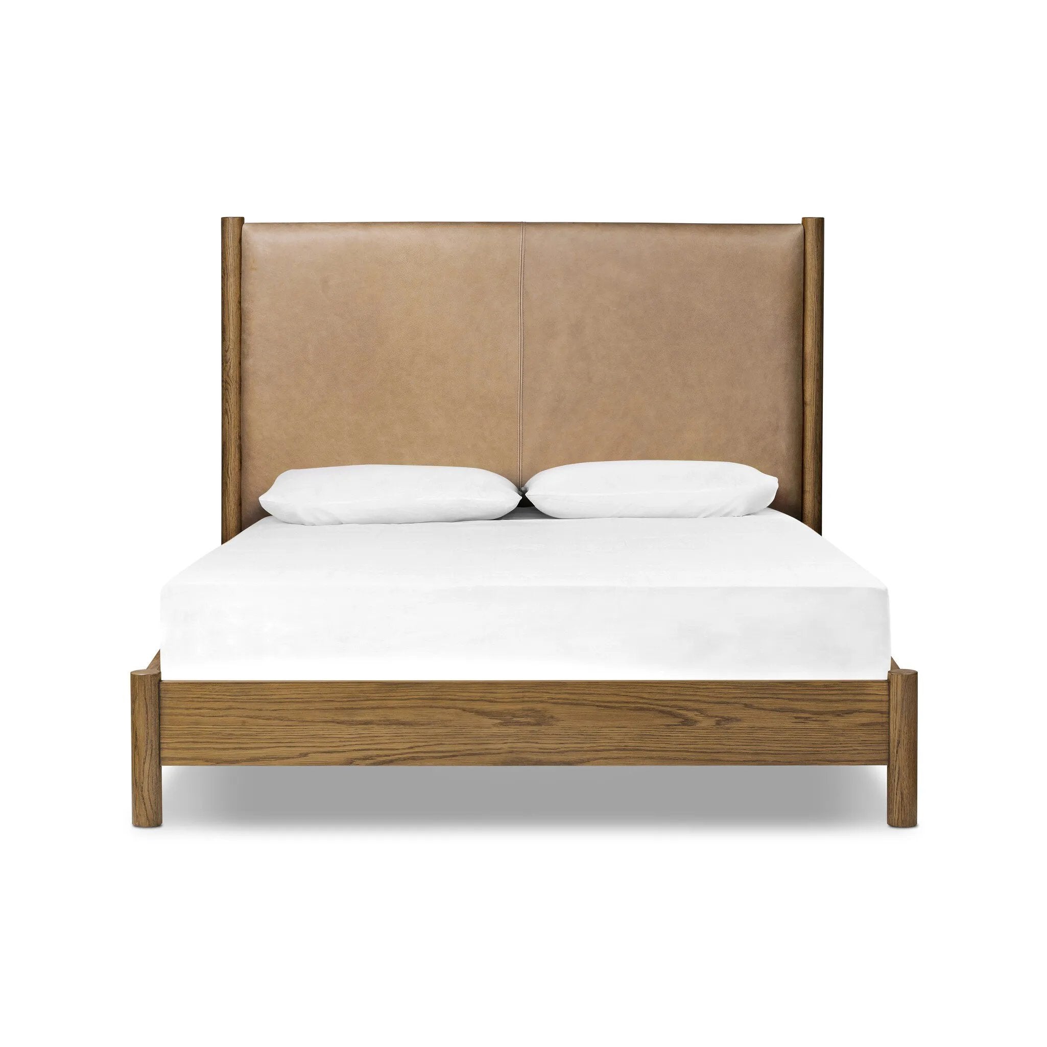 Rounded, chunky dowel legs in an amber oak finish frame the tan top-grain leather headboard of this simple-but-striking bed frame Amethyst Home provides interior design, new home construction design consulting, vintage area rugs, and lighting in the Austin metro area.