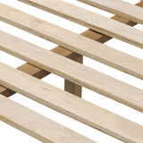 Rounded, chunky dowel legs in an amber oak finish frame the tan top-grain leather headboard of this simple-but-striking bed frame Amethyst Home provides interior design, new home construction design consulting, vintage area rugs, and lighting in the Los Angeles metro area.