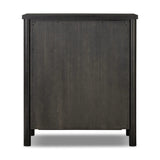 Create storage space in the bedroom with a five-drawer dresser of ebony-finished oak. Chunky dowel legs support a tall silhouette and overhang top, all finished out with simple gunmetal hardware Amethyst Home provides interior design, new home construction design consulting, vintage area rugs, and lighting in the Miami metro area.