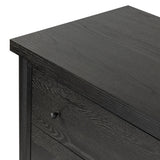 Create storage space in the bedroom with a five-drawer dresser of ebony-finished oak. Chunky dowel legs support a tall silhouette and overhang top, all finished out with simple gunmetal hardware Amethyst Home provides interior design, new home construction design consulting, vintage area rugs, and lighting in the Park City metro area.