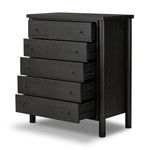 Create storage space in the bedroom with a five-drawer dresser of ebony-finished oak. Chunky dowel legs support a tall silhouette and overhang top, all finished out with simple gunmetal hardware Amethyst Home provides interior design, new home construction design consulting, vintage area rugs, and lighting in the Portland metro area.