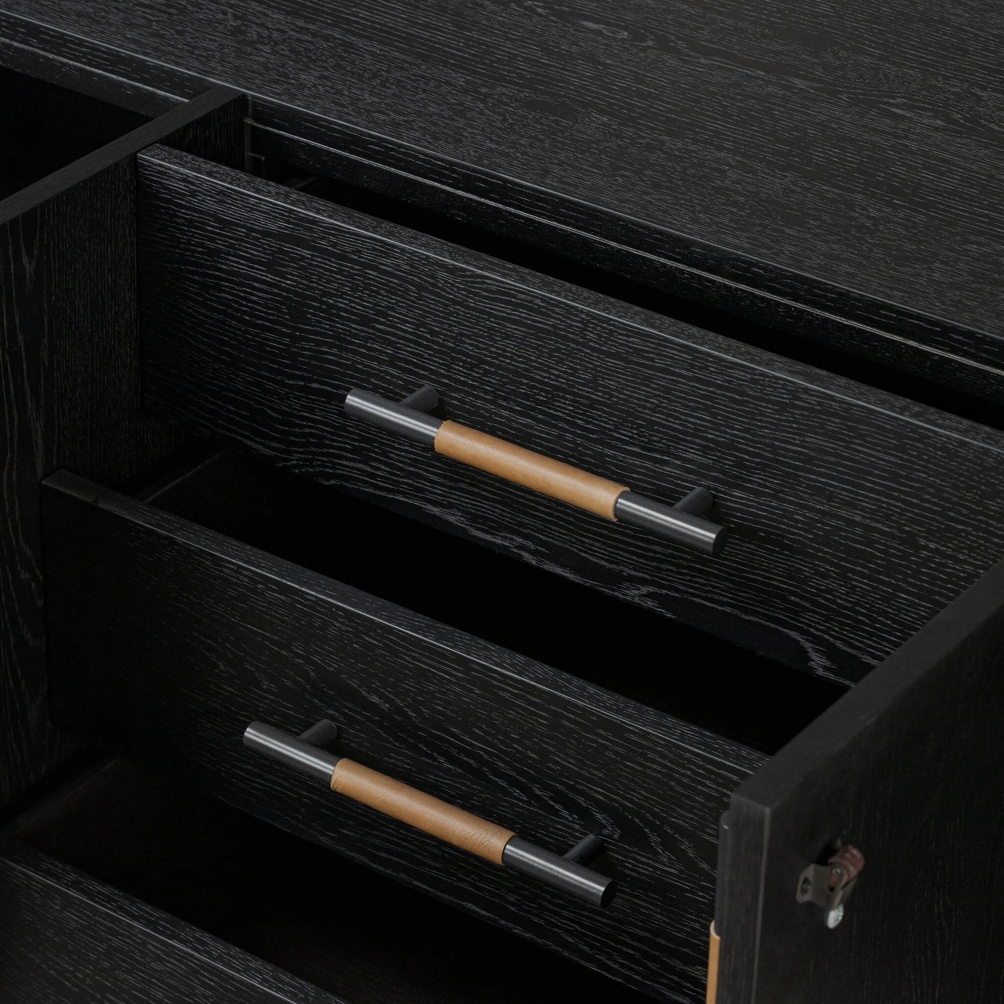 Featuring Rosedale Ebony Oak Veneer Media Console by Four Hands at Amethyst Home. This Rosedale Ebony Oak Veneer Media Console is the perfect addition to any media room or living space. Made with high-quality materials and a sleek design, this media console provides ample storage for all of your media devices. With its ebony oak veneer finish, it is both styl. Amethyst Home provides interior design, new home construction design consulting, vintage area rugs, and lighting in the Houston metro area.