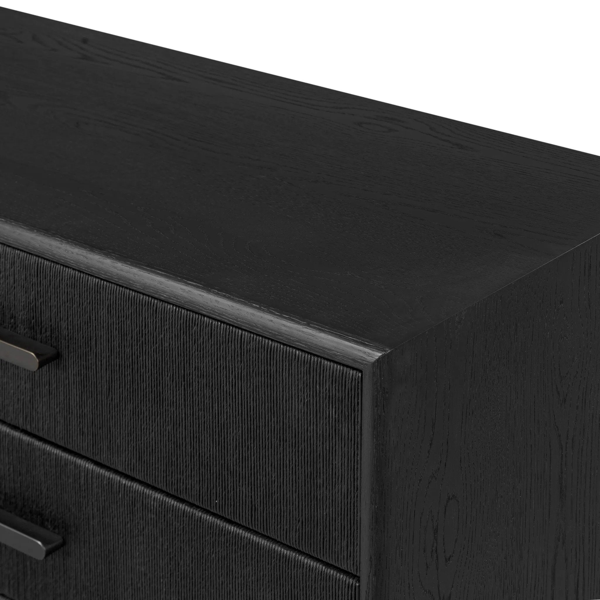 Elevate your bedroom styling with a storage-driven dresser of black-finished oak. A smooth top pairs with eight spacious drawers covered with woven paper cord. The result: a dark, Scandinavian-inspired look that will work into your collection beautifully Amethyst Home provides interior design, new home construction design consulting, vintage area rugs, and lighting in the Calabasas metro area.