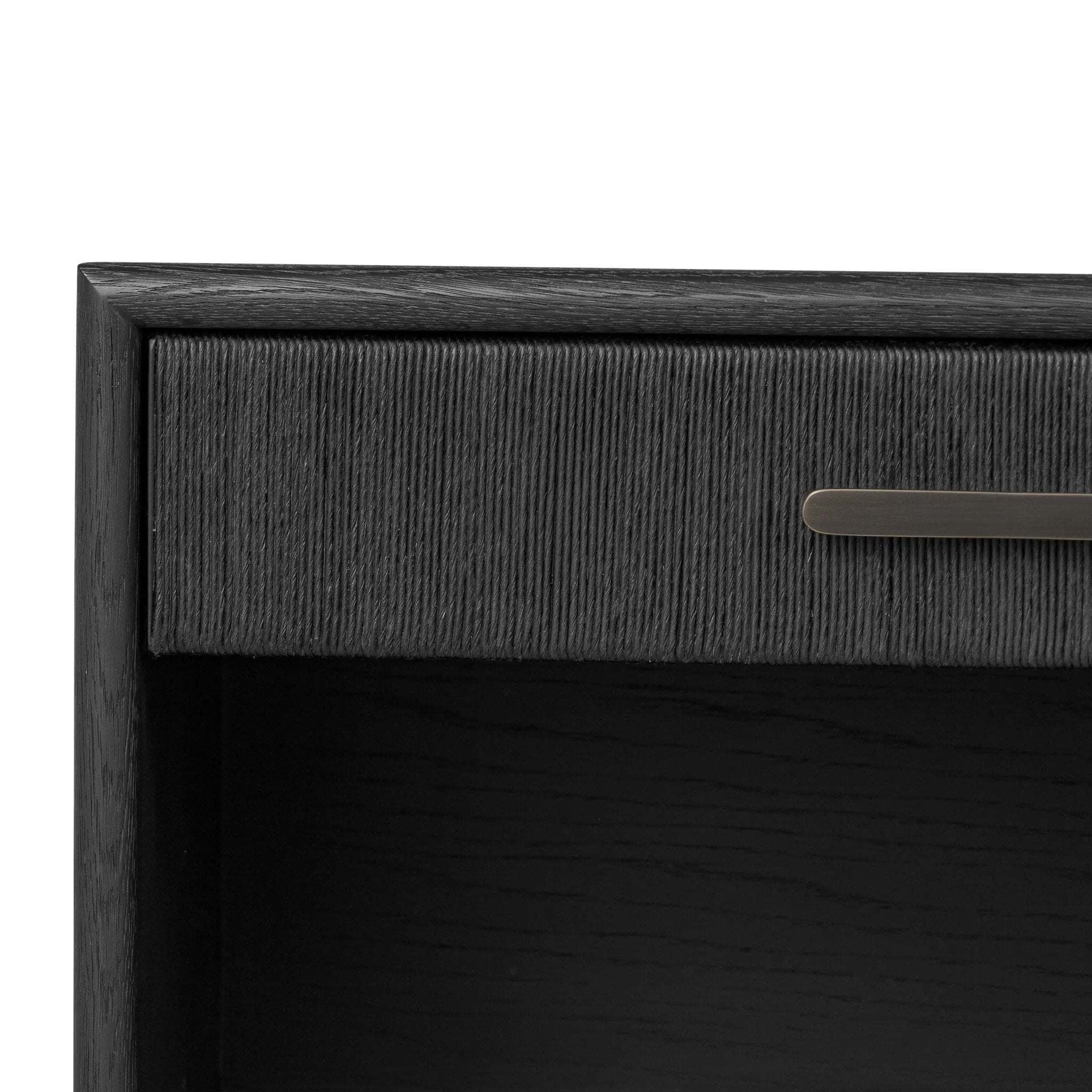 Elevate your bedside storage with a nightstand of black-finished oak. A smooth top pairs with a single drawer front of woven paper cord for a dark, rich look that will work into your bedroom collection beautifully Amethyst Home provides interior design, new home construction design consulting, vintage area rugs, and lighting in the Nashville metro area.