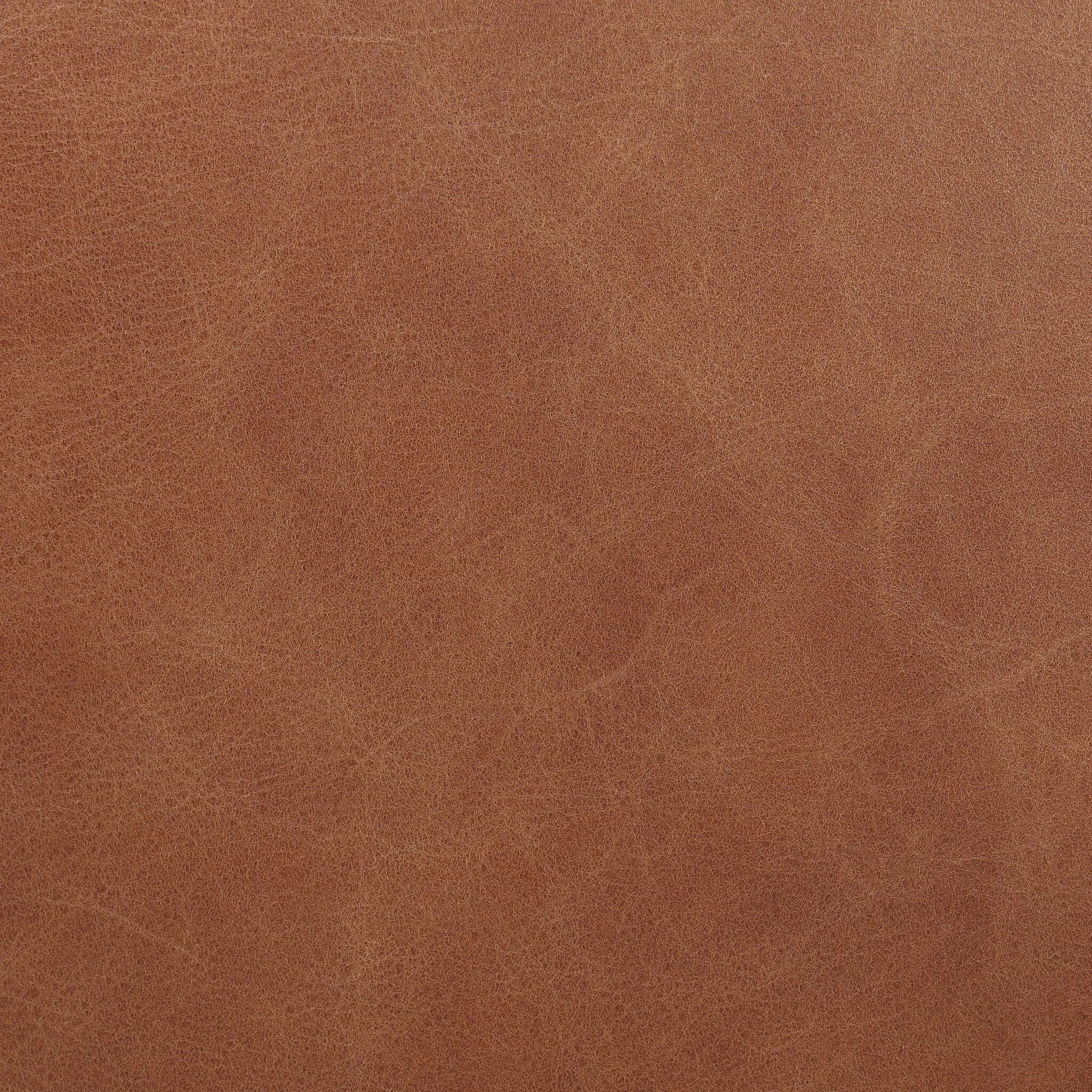 Shiny stainless steel frames tan top-grain leather cushioning for a balance of comfort and edge. Overfilled for a relaxed sit, the cushioned seat and back keep things supportive. Adjustable height and smooth 360-swivel bring ease to your workspace Amethyst Home provides interior design, new home construction design consulting, vintage area rugs, and lighting in the Newport Beach metro area.