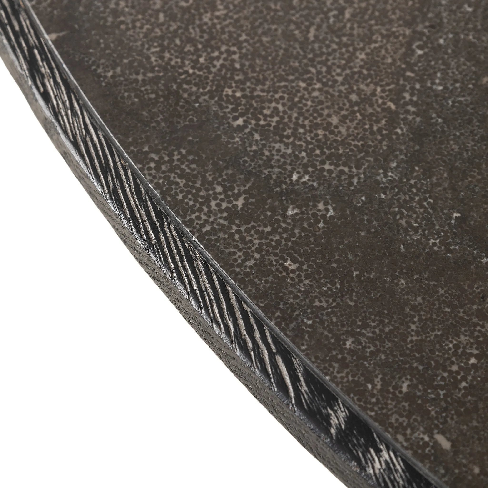 Mixed materials make for great drama. A cone-tapered base of dark oak supports a rounded tabletop of solid bluestone, with oak banding on the edges for thoughtful contrast Amethyst Home provides interior design, new home construction design consulting, vintage area rugs, and lighting in the Alpharetta metro area.