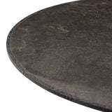Mixed materials make for great drama. A cone-tapered base of dark oak supports a rounded tabletop of solid bluestone, with oak banding on the edges for thoughtful contrast Amethyst Home provides interior design, new home construction design consulting, vintage area rugs, and lighting in the Boston metro area.