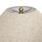 Inspired by vintage vessels, a stout table lamp bears the unique markings of natural terracotta. Topped with a neutral linen shade for texture and contrast Amethyst Home provides interior design, new home construction design consulting, vintage area rugs, and lighting in the Washington metro area.
