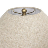 Inspired by vintage vessels, a stout table lamp bears the unique markings of natural terracotta. Topped with a neutral linen shade for texture and contrast Amethyst Home provides interior design, new home construction design consulting, vintage area rugs, and lighting in the Washington metro area.