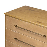 Bring a Nordic, material-driven look to your bedroom with a six-drawer dresser of grain-rich oak and drawer fronts covered with tan top-grain leather. Finished out with long, linear iron hardware Amethyst Home provides interior design, new home construction design consulting, vintage area rugs, and lighting in the Tampa metro area.