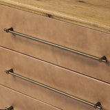 Bring a Nordic, material-driven look to your bedroom with a six-drawer dresser of grain-rich oak and drawer fronts covered with tan top-grain leather. Finished out with long, linear iron hardware Amethyst Home provides interior design, new home construction design consulting, vintage area rugs, and lighting in the Washington metro area.