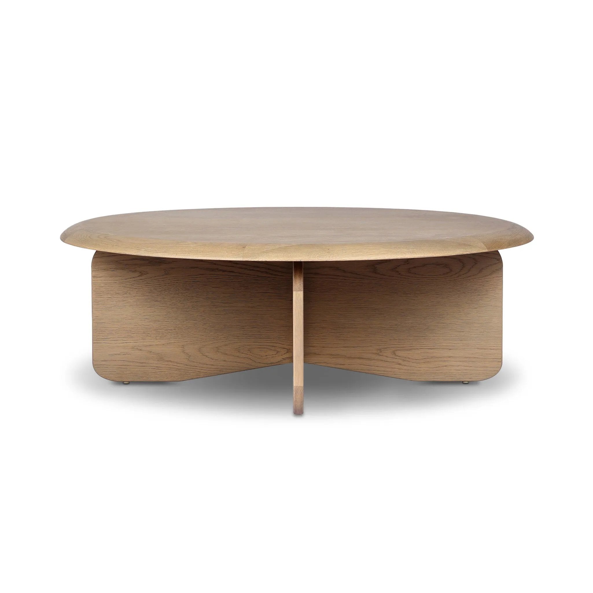 Featuring Surie Sandy Oak Resawn Coffee Table by Four Hands at Amethyst Home. A shape-driven piece inspired by clean Nordic design. Softened edges and a curved base craft a sense of flow, accentuated by cathedral grain oak with beautiful natural warmth. Overall Dimensions: 48.00"w x 48.00"d x 16.50"h. Amethyst Home provides interior design, new home construction design consulting, vintage area rugs, and lighting in the Des Moines metro area.