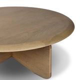 Featuring Surie Sandy Oak Resawn Coffee Table by Four Hands at Amethyst Home. A shape-driven piece inspired by clean Nordic design. Softened edges and a curved base craft a sense of flow, accentuated by cathedral grain oak with beautiful natural warmth. Overall Dimensions: 48.00"w x 48.00"d x 16.50"h. Amethyst Home provides interior design, new home construction design consulting, vintage area rugs, and lighting in the Salt Lake City metro area.