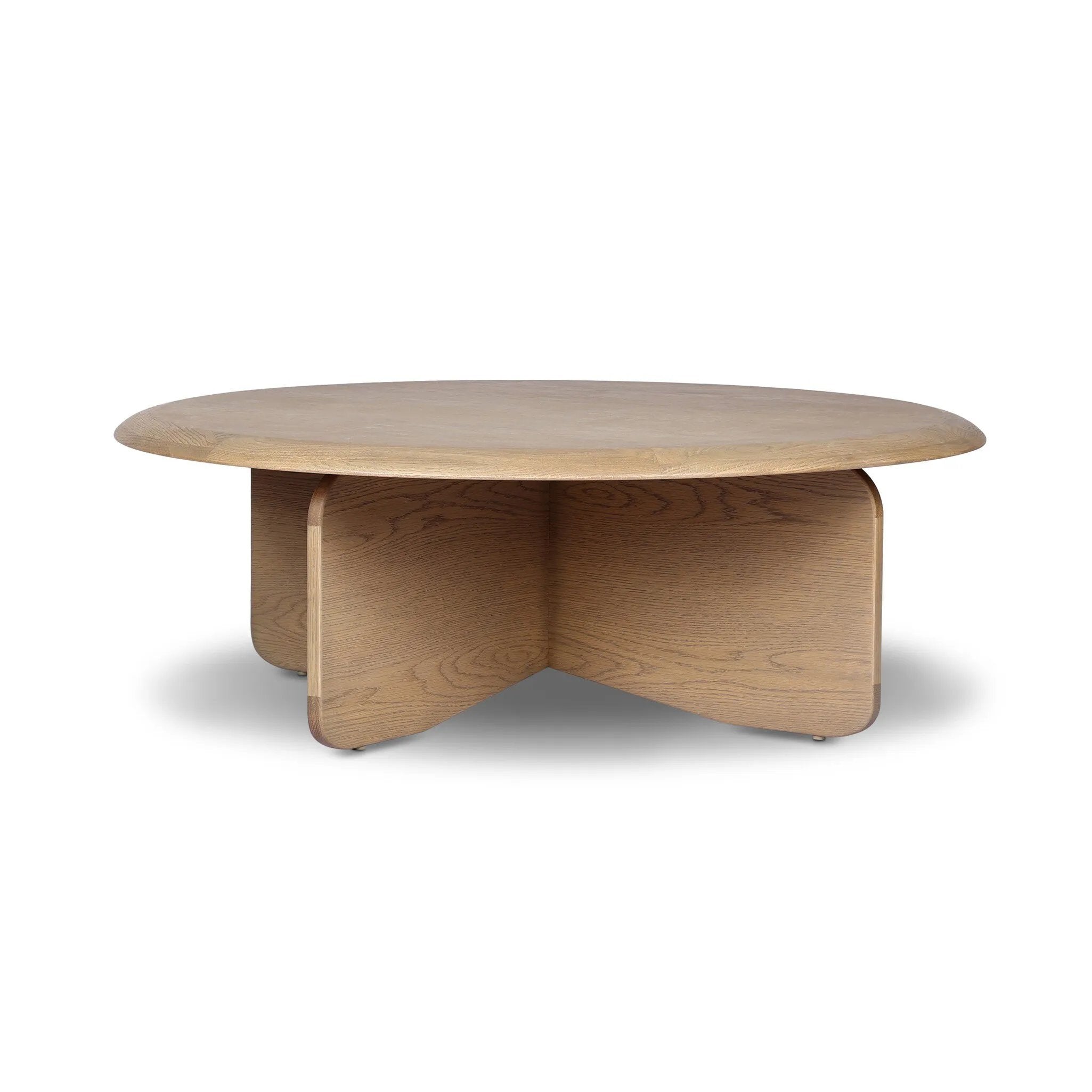 Featuring Surie Sandy Oak Resawn Coffee Table by Four Hands at Amethyst Home. A shape-driven piece inspired by clean Nordic design. Softened edges and a curved base craft a sense of flow, accentuated by cathedral grain oak with beautiful natural warmth. Overall Dimensions: 48.00"w x 48.00"d x 16.50"h. Amethyst Home provides interior design, new home construction design consulting, vintage area rugs, and lighting in the San Diego metro area.