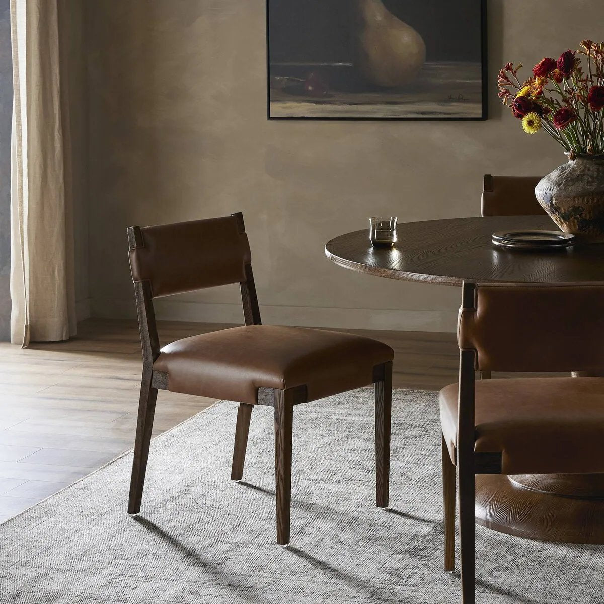 Featuring Tamari Sonoma Chestnut Dining Chair by Four Hands at Amethyst Home. Upgrade your dining experience with the Tamari Sonoma Chestnut Dining Chair. Made with high-quality materials, this chair provides comfortable seating while adding a touch of elegance to your dining room. Its sleek design and sturdy construction make it the perfect addition to any. Amethyst Home provides interior design, new home construction design consulting, vintage area rugs, and lighting in the San Diego metro area.