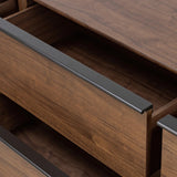 Dark brown walnut is aesthetically shaped with fluid, rounded corners on a ski leg base. The seamless design features six spacious drawers with metal bar hardware that runs along the tops of the drawers Amethyst Home provides interior design, new home construction design consulting, vintage area rugs, and lighting in the Washington metro area.