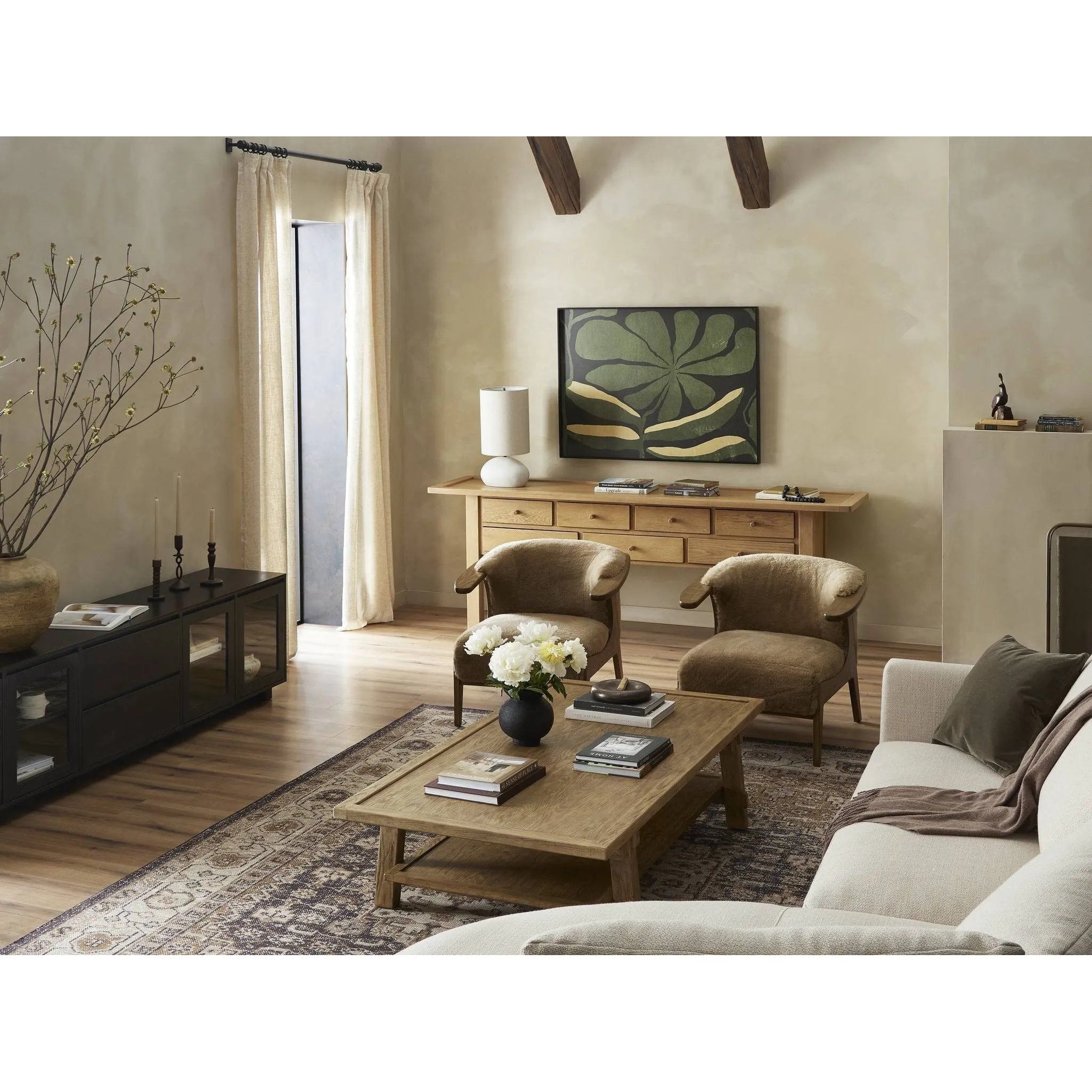 Featuring Trinity Distressed Light Oak Coffee Table by Four Hands at Amethyst Home. This Asian-inspired design made from light, distressed oak features mortise-and-tenon joinery, which connects protruding stretchers to sturdy legs. Lower shelving for bonus storage and display.Overall Dimensions: 65.00"w x 35.50"d x 16.00"hWeight : 127.87 lbsMaterials : So. Amethyst Home provides interior design, new home construction design consulting, vintage area rugs, and lighting in the Los Angeles metro area.