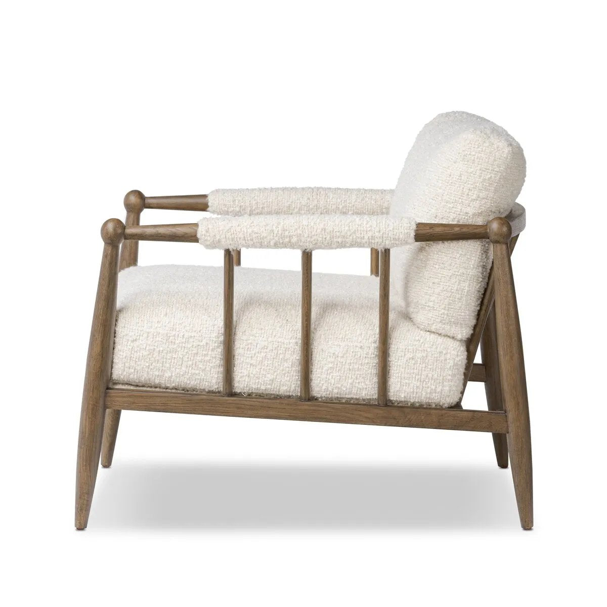 Featuring Warren Ivan Snow Chair by Four Hands at Amethyst Home. A classic silhouette through a contemporary lens. Framed in vintage oak, this accent chair features tapered legs, spindles along the arms and bauble details. Finished in Turkish-made upholstery with a heavy pile that blends brushed, pulled and boucle styles, it's woven into a subtle linear pattern. Amethyst Home provides interior design, new home construction design consulting, vintage area rugs, and lighting in the Tampa metro area.