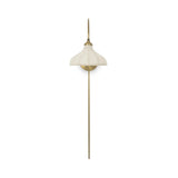 Slim and curved, a swan-neck arm supports a bell-shaped linen shade with brass boning, updating a traditional lighting look. This plug-in sconce design brings warm illumination to any space while discreet cord management keeps the look polished. Ideal for crafting warm, inviting reading corners or bedside ambiance Amethyst Home provides interior design, new home construction design consulting, vintage area rugs, and lighting in the Monterey metro area.
