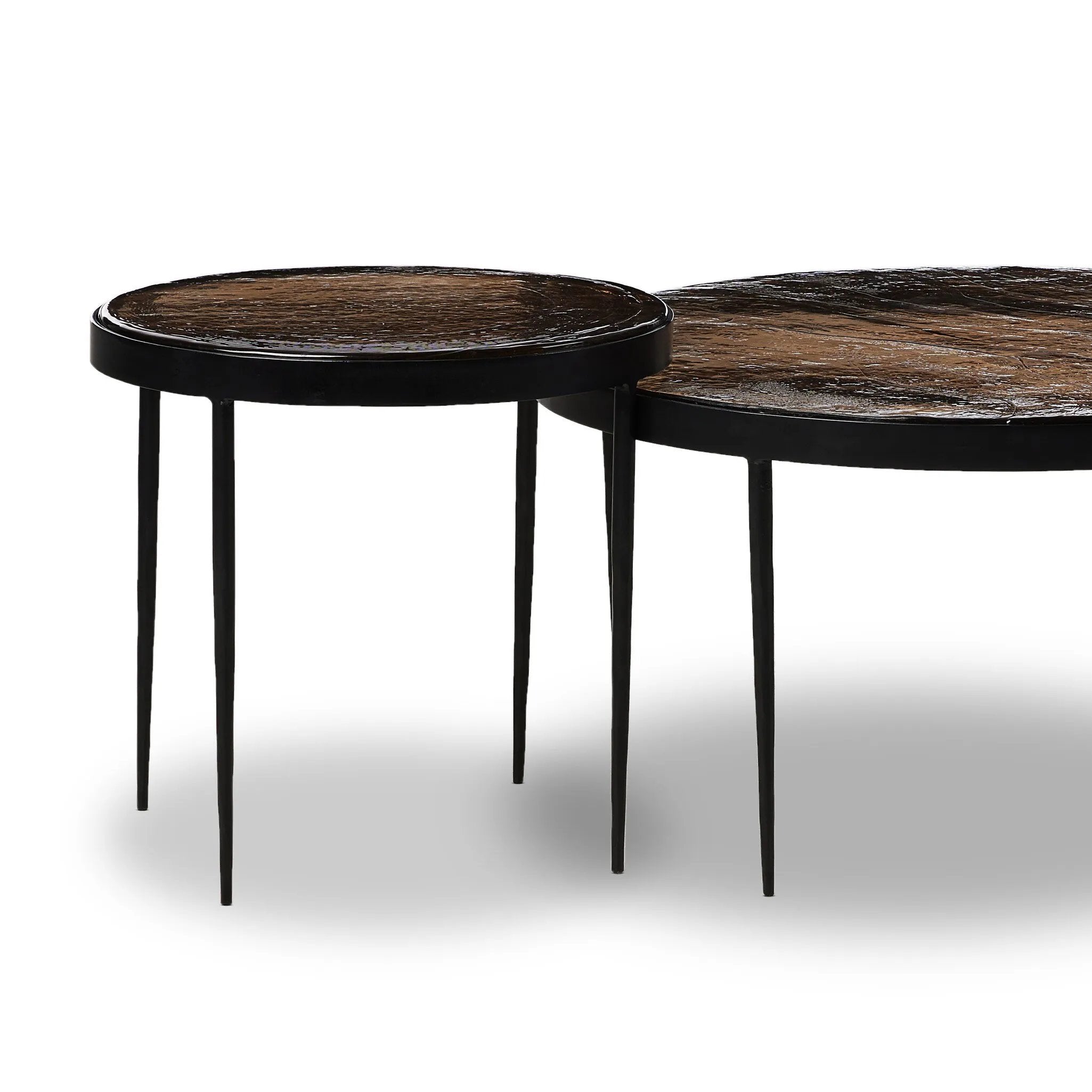 Featuring Yoko Smoked Brown Cast Glass Nesting Table by Four Hands at Amethyst Home. Smoky brown glass tops with slim, tapere