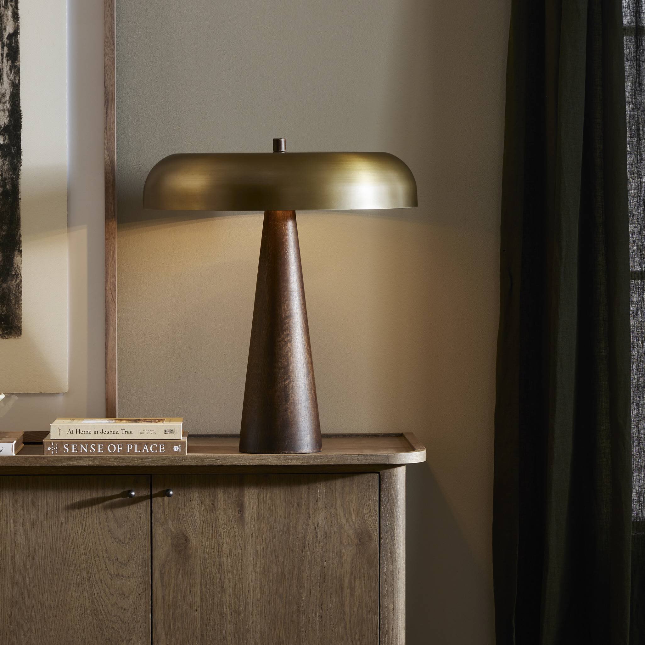 Featuring Griffin Russet Mango Table Lamp by Four Hands at Amethyst Home. A stylish nod to midcentury mushroom lamps, this beautifully scaled wooden lamp features a gleaming metal shade finished in aged brass. It's topped with a small wood finial to complete the look.Overall Dimensions: 20.00"w x 20.00"d x 22.75"hWeight : 15.78 lbsMaterials : Solid Mango, Iron. Amethyst Home provides interior design, new construction, custom furniture, and area rugs in the Nashville metro area