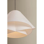 The dynamically layered design of the Edna pendant seeks to push the boundaries of what is possible with a handmade paper shade construction. Constructed as one piece, the shade is comprised of three identical pieces that intersect one another in a perfect geometric array. Amethyst Home provides interior design, new home construction design consulting, vintage area rugs, and lighting in the Nashville metro area.