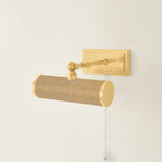 Whether you want to bring more attention to artwork or highlight a wall shelf of your favorite things, Holly is up to the task. This plug-in picture light now comes in an Aged Brass or Natural Grasscloth finish to create a more traditional or distinctive look. Amethyst Home provides interior design, new home construction design consulting, vintage area rugs, and lighting in the Scottsdale metro area.