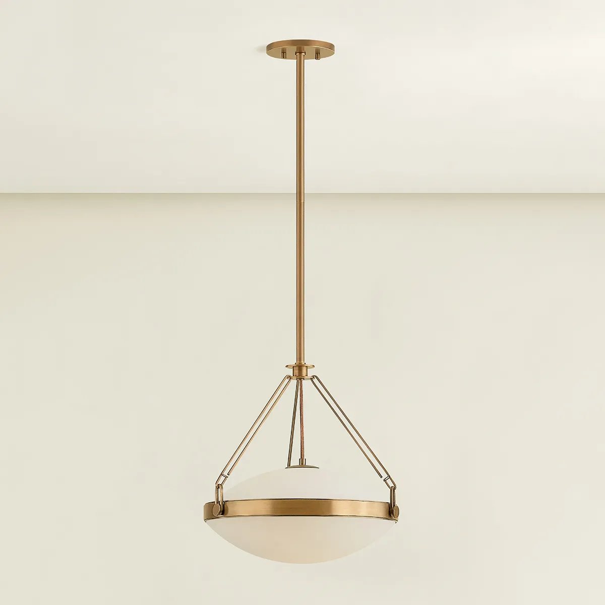 The Kade pendant updates a nostalgic shape with sleek, industrial metalwork and two large opal matte glass shades. Inspired by vintage elements, it features a striking suspension technique with three oversized loops connecting to the central housing above the fixture. The Patina Brass finish adds old-world finesse to the frame. Amethyst Home provides interior design, new home construction design consulting, vintage area rugs, and lighting in the Omaha metro area.