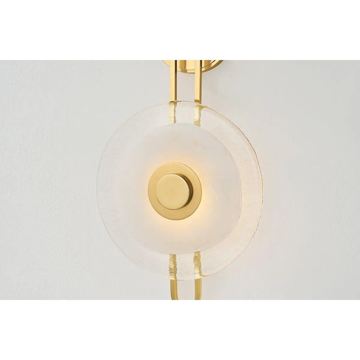 The earring-like design of Keuka Park exudes ornamental, graphic appeal. A thick disc of Blonchino Piastre glass is illuminated at the point where it attaches to the racetrack frame of this striking wall fixture. Whether finished in Aged Brass or Old Bronze, Keuka Park brings modernist artistry to any wall. Amethyst Home provides interior design, new home construction design consulting, vintage area rugs, and lighting in the Winter Garden metro area.