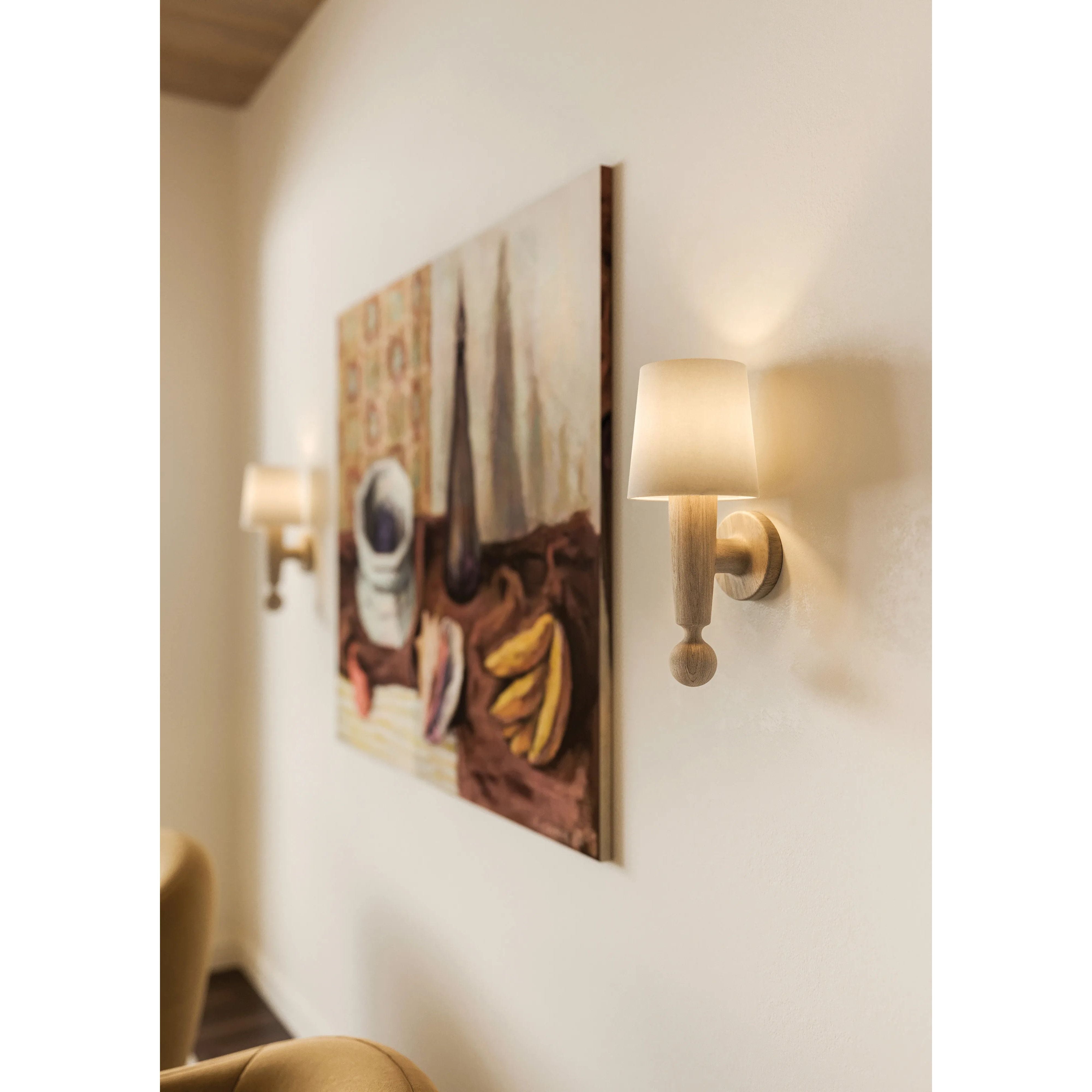 Inspired by the Scandinavian minimalist designs of Uno & Östen Kristiansson, the Nola sconce’s gentle forms are constructed from natural neutrals. The base of the sconce has been handcarved from Cerused Whitewash Wood with its vertical grain and blond finish adding a dynamic texture to the piece. Amethyst Home provides interior design, new home construction design consulting, vintage area rugs, and lighting in the Nashville metro area.