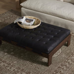 Featuring Halston Heirloom Black Cocktail Ottoman by Four Hands at Amethyst Home. A Seventies-era style inspired by a flea market find. Top-grain leather features dramatic tufting with sling detailing and wide ash framing below. Sourced from one of the oldest family-owned tanneries in Italy's Bassano del Grappa, heirloom leather is salvaged and processed from upcycled hides featuring . Amethyst Home provides interior design, new construction, custom furniture, and area rugs in the Tampa metro area