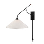 Featuring Hassell Jet Black Sconce by Four Hands at Amethyst Home. A flax linen shade with subtle flecking pairs with a sleek black metal body and dark walnut handle. Dual points of articulation including a horizontal arm rotation and vertical shade adjustment ensure precise light positioning. The plug-in design features a cord-concealing pipe and wall-mounted backplates for . Amethyst Home provides interior design, new construction, custom furniture, and area rugs in the Salt Lake City metro area