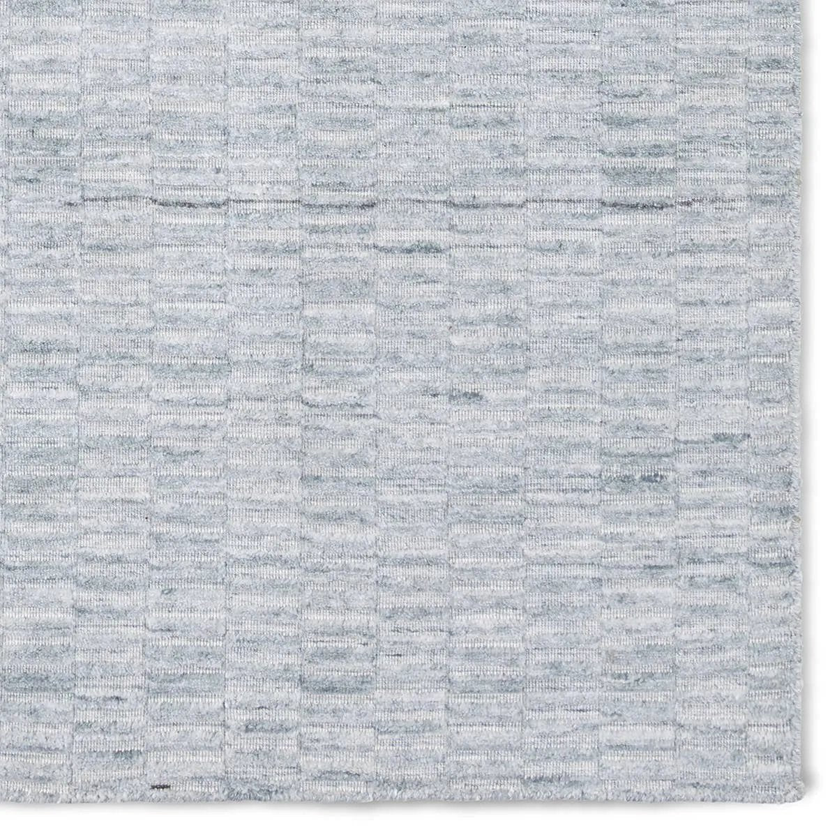 Featuring Roan Aaren Rug by Jaipur Living at Amethyst Home. Made from 100% PET the indoor/ outdoor handwoven Roan Aaren is perfect for performance needs.  This pseudo-solid blue rug bodes a light checkered appearance with a neutral backdrop.
ROA01100% PET YarnROA01 Roan Aaren
Clean or remove stains by using mild soap. Rinse with clean water or a garden hose. H. Amethyst Home provides interior design, new home construction design consulting, vintage area rugs, and lighting in the Dallas metro area.