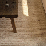 Featuring Alpine Oatmeal Hand-Knotted Rug by Jaipur Living at Amethyst Home. Drawing inspiration from Moroccan textiles, Alpine showcases the beauty in simplicity. Durable wool is hand-knotted onto a cotton foundation to create this high-piled accent piece. Its warm, solid tan design is finished with braided fringe trims for a touch of boho charm. Alpine insta. Amethyst Home provides interior design, new home construction design consulting, vintage area rugs, and lighting in the Austin metro area.