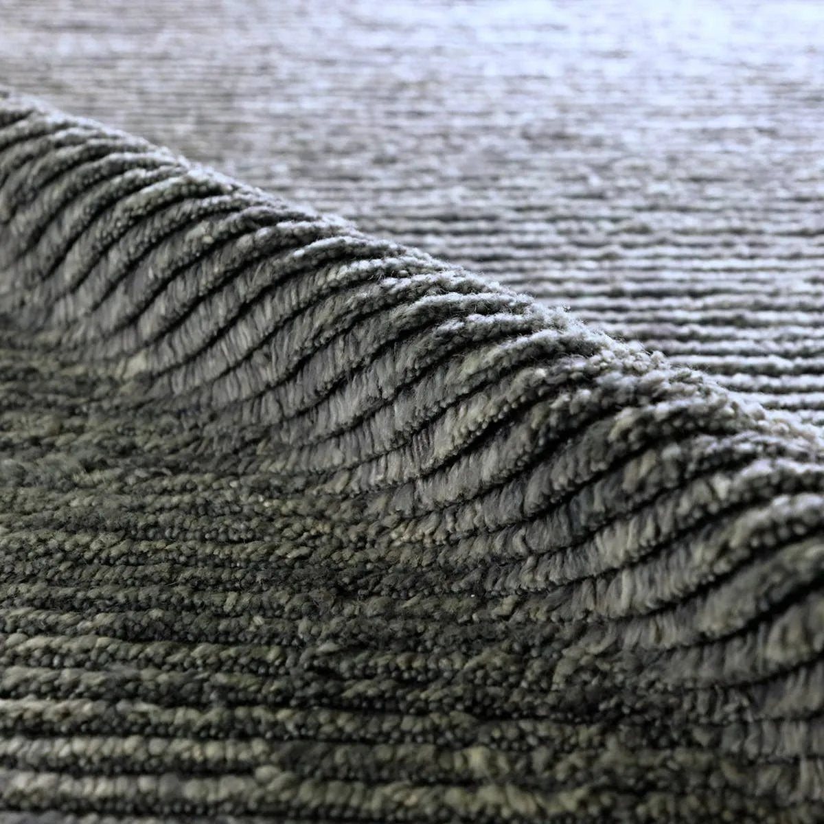 Featuring Alpine Hand-Knotted Rug by Jaipur Living at Amethyst Home. Drawing inspiration from Moroccan textiles, Alpine showcases the beauty in simplicity. Durable wool is hand-knotted onto a cotton foundation to create this high-piled accent piece. Its solid gray design instantly adds warmth and comfort to any indoor, medium-traffic setting.Hand Knotted100% . Amethyst Home provides interior design, new home construction design consulting, vintage area rugs, and lighting in the Houston metro area.